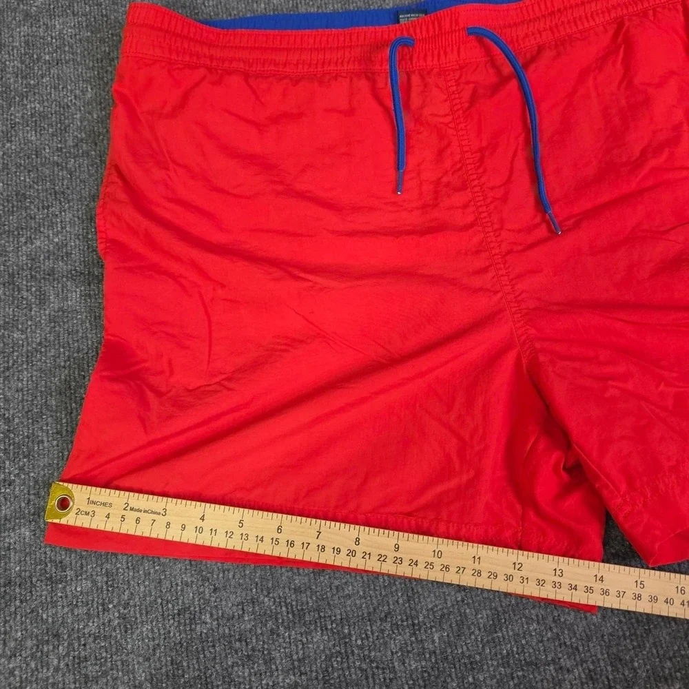 Polo Ralph Lauren orange swim shorts with blue drawstrings. Size XL.